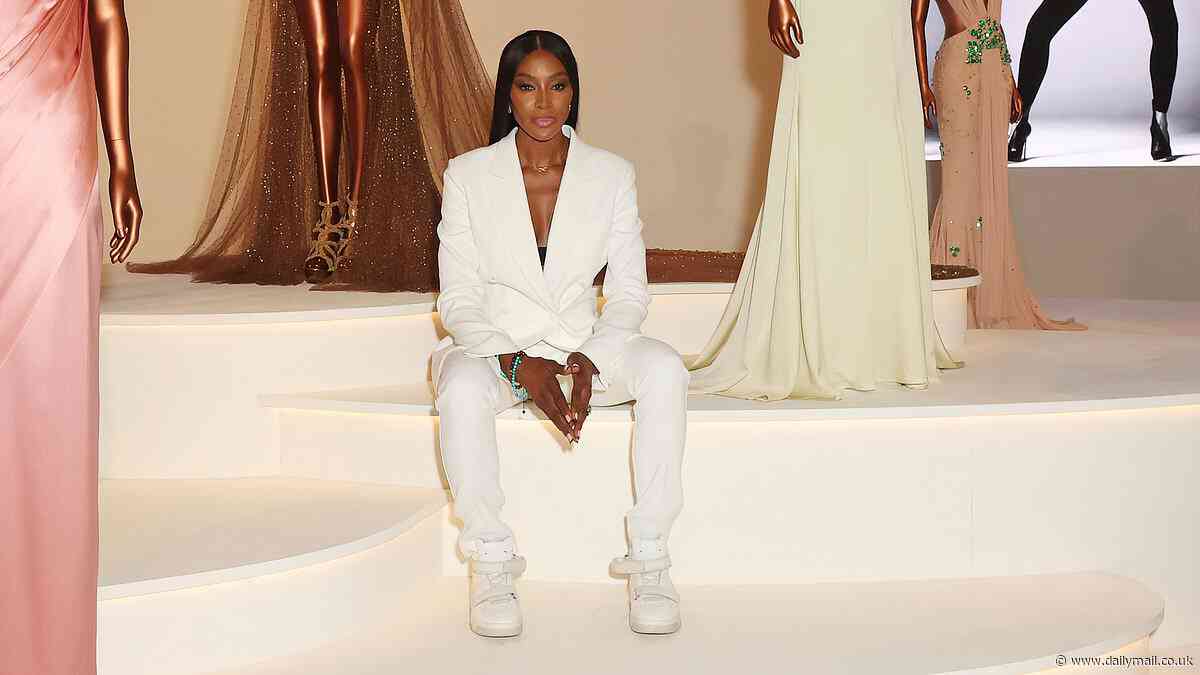 Naomi Campbell is the epitome of chic in a striking white suit as she attends the V&A opening of her 'Naomi: In Fashion' exhibition