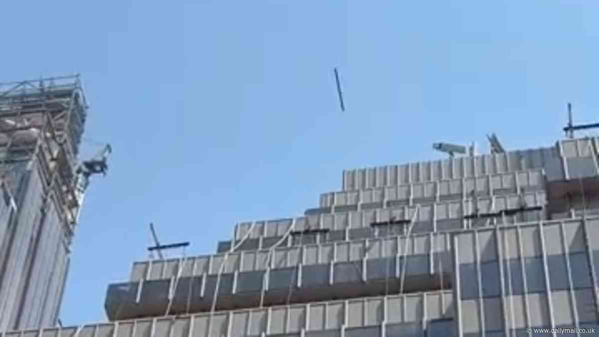 Heart-stopping moment a CHAIR is hurled out of an NYC high-rise along with other belongings