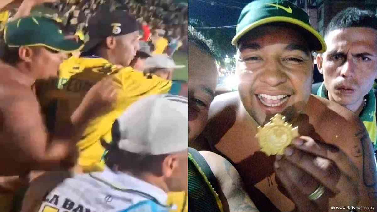 Sneaky moment fan removes medal from Colombian soccer player's neck as he celebrated winning championship