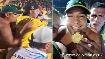 Sneaky moment fan removes medal from Colombian soccer player's neck as he celebrated winning championship