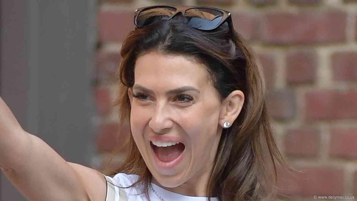 Hilaria Baldwin flashes a huge smile out in NYC - despite controversy over family reality show filming amid Alec Baldwin's upcoming Rust shooting trial