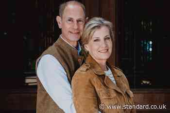 Edward and Sophie embrace in silver wedding anniversary portrait