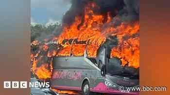 Driver's lucky escape as coach engulfed in flames