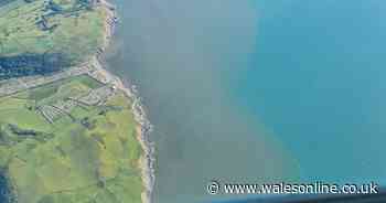 Huge slick of brown matter in the sea off the Welsh coast captured in aerial photograph
