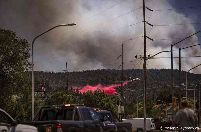 Cooler temps and rain could help corral blazes that forced thousands to fee New Mexico village