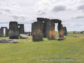 Climate protesters arrested after painting Stonehenge monument orange