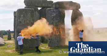Stonehenge sprayed with orange powder paint by Just Stop Oil activists