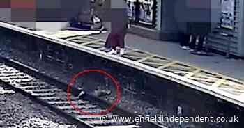 Watch: Boy, 3, saved from railway line moments  before train