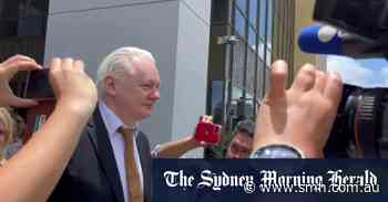 Assange walks out from court a free man