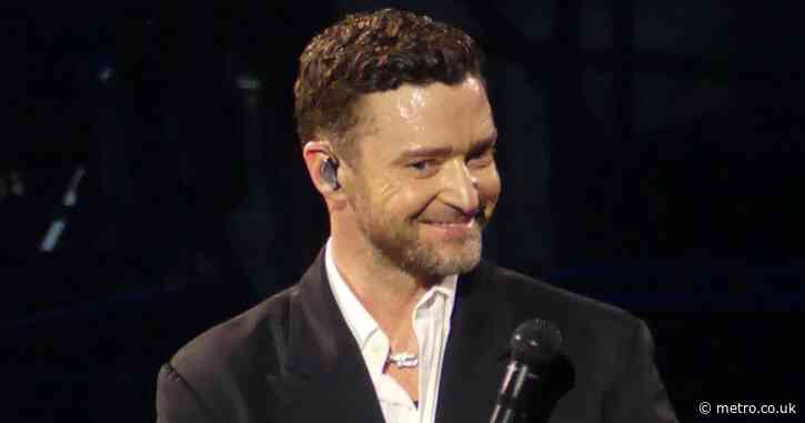 Justin Timberlake looks bright-eyed and carefree as he smiles through concert after arrest