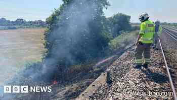 Train services hit after line-side fire