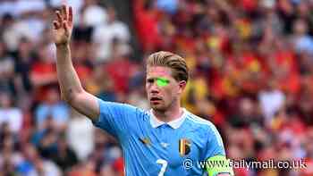 Kevin De Bruyne is targeted by a laser pen during Belgium's crunch Euro 2024 clash with Ukraine... before the Man City star almost scores an audacious free-kick just seconds later