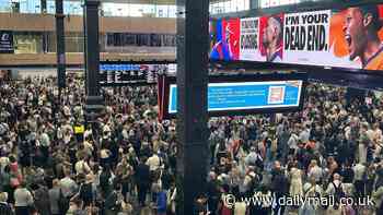 Chaos at Euston Station as passengers trapped on unbearably hot trains 'with broken air conditioning' and faulty announcement system after signal failure