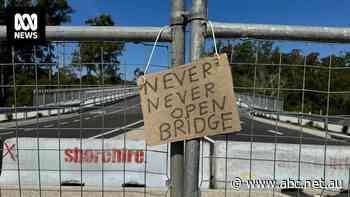 The 'never never open bridge' was completed six months ago — but residents still can't cross it