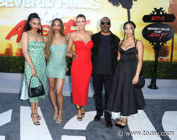 Eddie Murphy poses with 3 of his 10 kids at 'Beverly Hills Cop' premiere