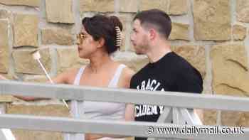 Priyanka Chopra and her husband Nick Jonas toast marshmallows at a friend's house on the Gold Coast after arriving in Australia to film her new movie