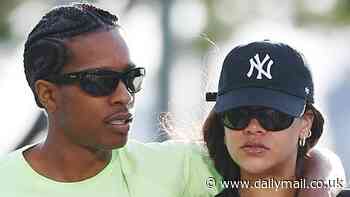 Rihanna looks sporty chic in leggings and a NY Yankees cap during loved-up stroll with boyfriend A$AP Rocky
