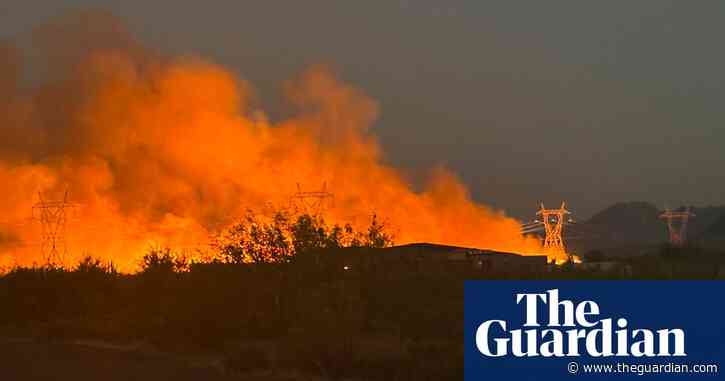 Firefighters near Phoenix battle wildfire as temperatures surpass 100F