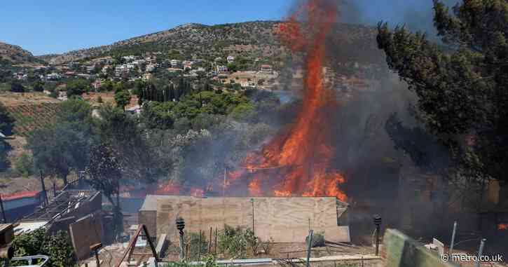 Race against time to evacuate people near Athens as wildfires rage