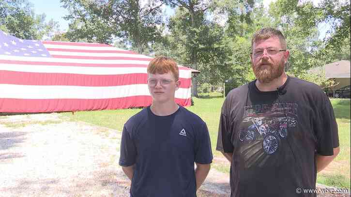 Family drapes 50-foot American flag over Walker home in honor of Fourth of July