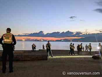 Vancouver police criticized for enforcing liquor laws by clearing English Bay beach at sunset
