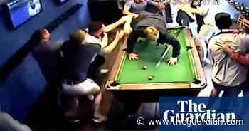 Fans dive across pool table in euphoric celebration of Jude Bellingham goal – video