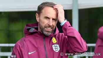 Food for thought, Gareth? Southgate watches on as England players train after dramatic Slovakia win with Jude Bellingham - who is being investigated for gesture after his goal - all smiles