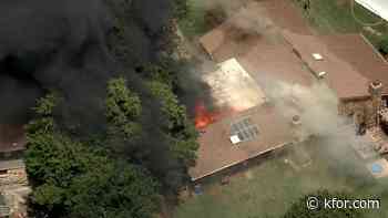 Crews battling heavy flames at Edmond home