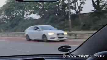 Moment car comes hurtling towards oncoming traffic on the M4 as driver sparks panic by going the wrong way