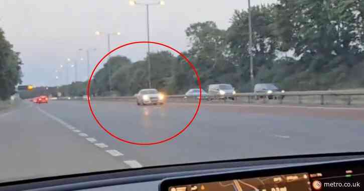 ‘Idiot’ Audi driver speeds wrong way down a motorway