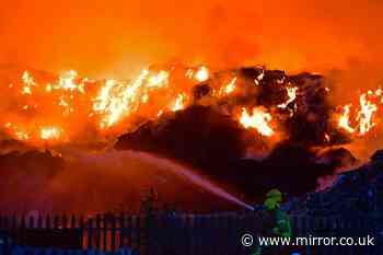 Major fire at industrial estate rages as firefighters battle massive flames