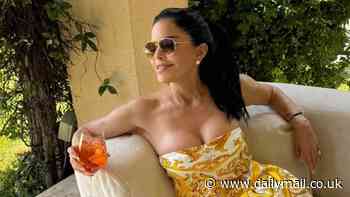 Lauren Sanchez, 54, flaunts her cleavage in a low-cut designer dress while sipping on an Aperol spritz as she enjoys summer getaway with billionaire fiance Jeff Bezos