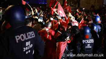 Police arrest 19 people after thousands of Turkish fans hit the streets in Germany to celebrate Euro 2024 last-16 win - with one officer injured and firecrackers aimed at cops