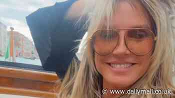 Heidi Klum, 51, set pulses racing as she flashes her underboob in a racy cut-out dress while riding a gondola in Venice