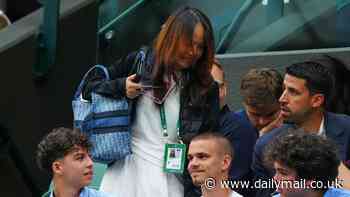 Excuse me! Emma Raducanu's mum squeezes past Romeo Beckham to watch her daughter take first set at Wimbledon