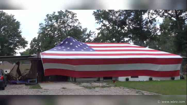 Father-son duo addresses flag code concerns after displaying 50-foot flag on home