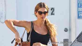 Gisele Bundchen wears skintight black leggings and matching tank top in Miami - after a romantic getaway with boyfriend Joaquim Valente
