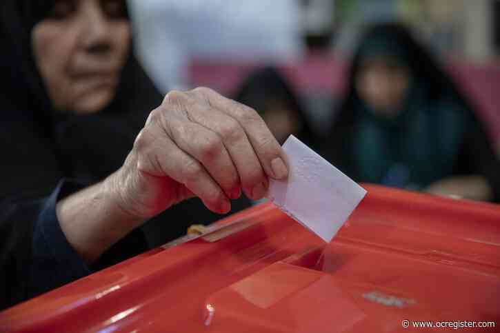 Reformer vs. hard-liner as Iran votes in presidential runoff
