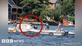 Moment teen jumps from jet ski to stop runaway boat