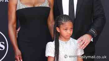 Serena Williams poses on the red carpet with husband Alexis Ohanian and their daughter Olympia before she hosts the ESPY Awards in Los Angeles