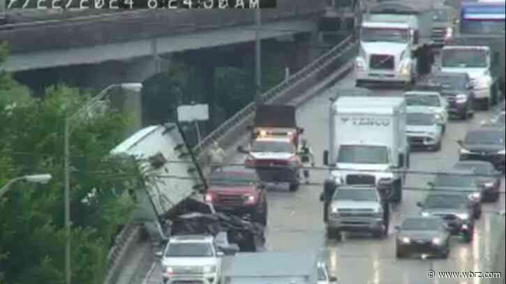 Coroner contacted after crash leaves 18-wheeler cab dangling off I-10 overpass; police said driver was ejected