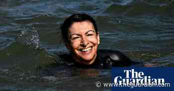 Paris mayor swims in Seine to show river is clean enough for Olympics – video