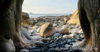 The secluded beach with 'dinosaur egg' boulders and historic submarine wreck