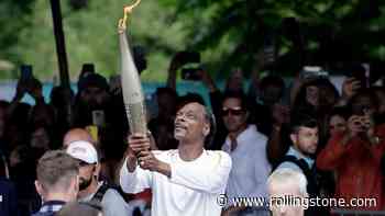 See Snoop Dogg Serve as Torch Bearer Ahead of Paris Olympics