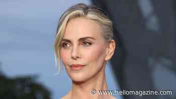 Charlize Theron rocks Parisian chic in unforgettable white dress