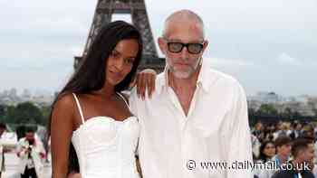 Vincent Cassel, 57, and girlfriend Narah Baptista, 27, put on a loved-up display as they arrive at the Opening Ceremony of the Olympics in Paris