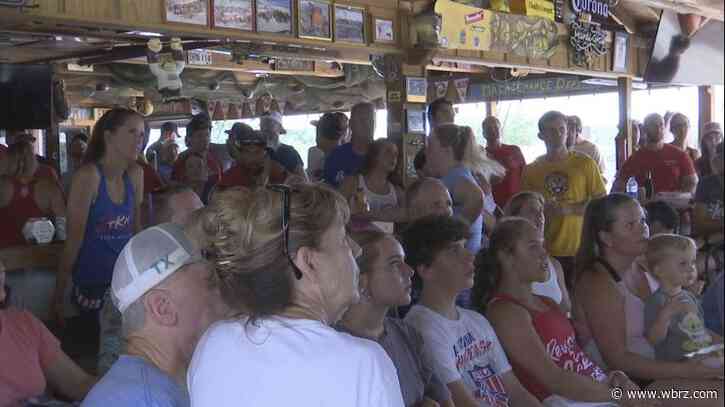 Beach volleyball fans gather to watch former LSU duo's first Olympic match at court they trained on