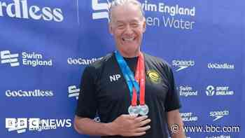 Cardiac arrest swimmer's silver medals  in race return