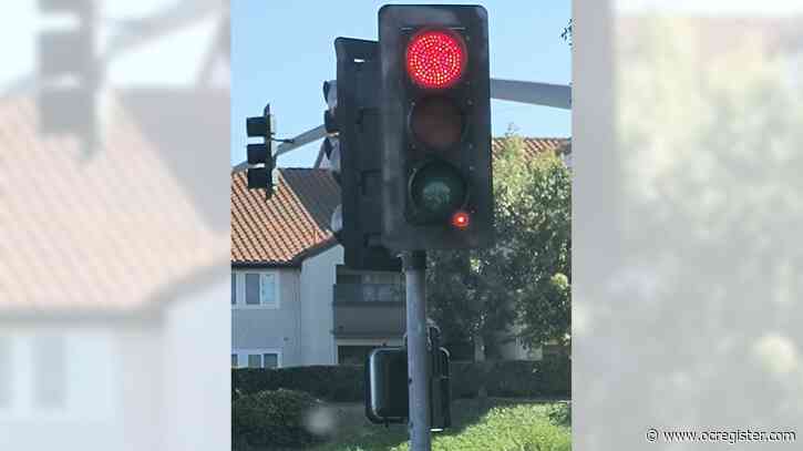 Why is there a tiny red light on the traffic signal? A camera?