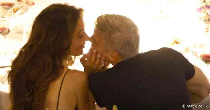 George and Amal Clooney can’t help themselves as they share passionate public kiss